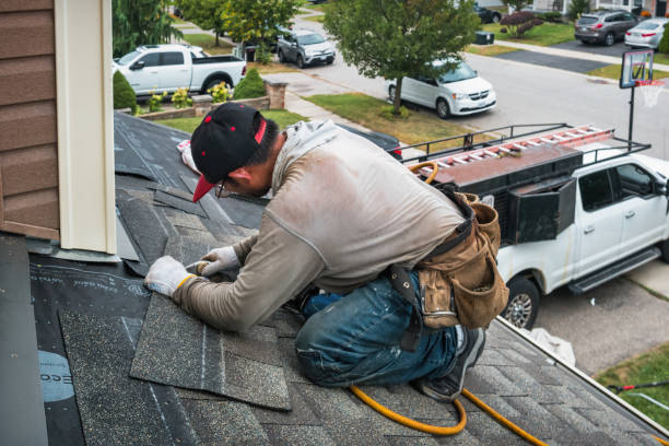 Professional Roof Replacement technician working in Sand Lake, MI